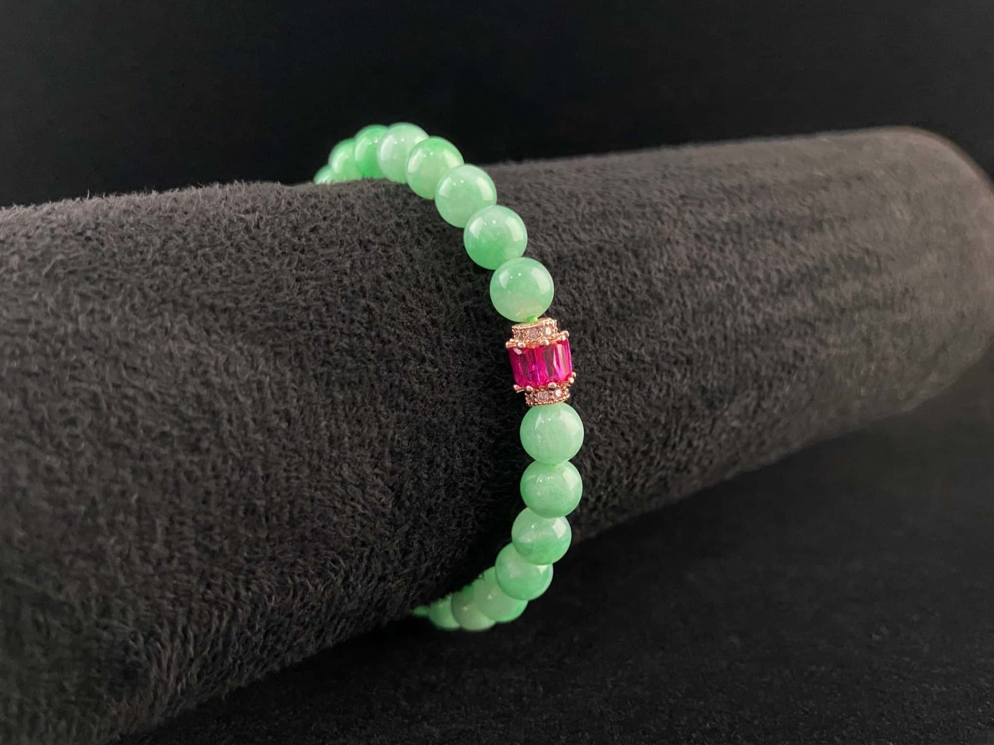 A pale mint and pink spark jadeite beads bracelet.