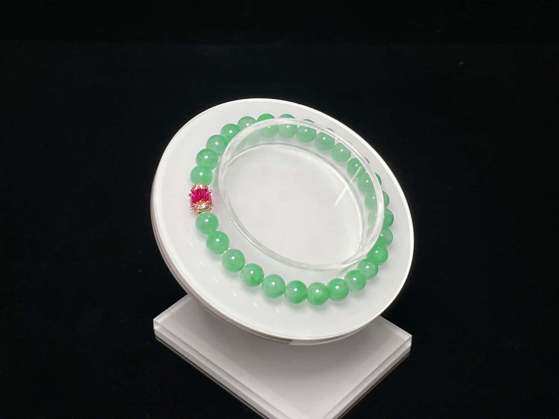 A pale mint and pink spark jadeite beads bracelet.