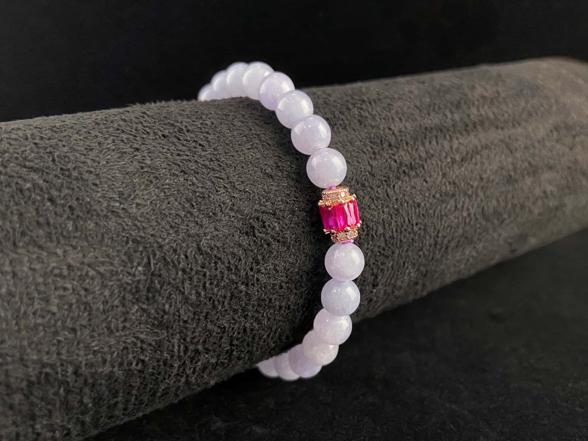 A clear white with pink thread jadeite beads bracelet.