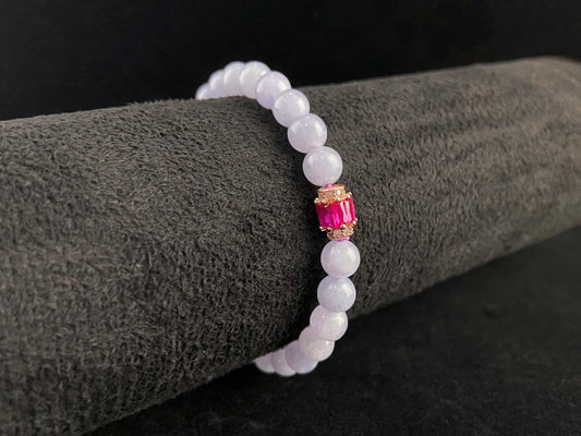 A clear white with pink thread jadeite beads bracelet.