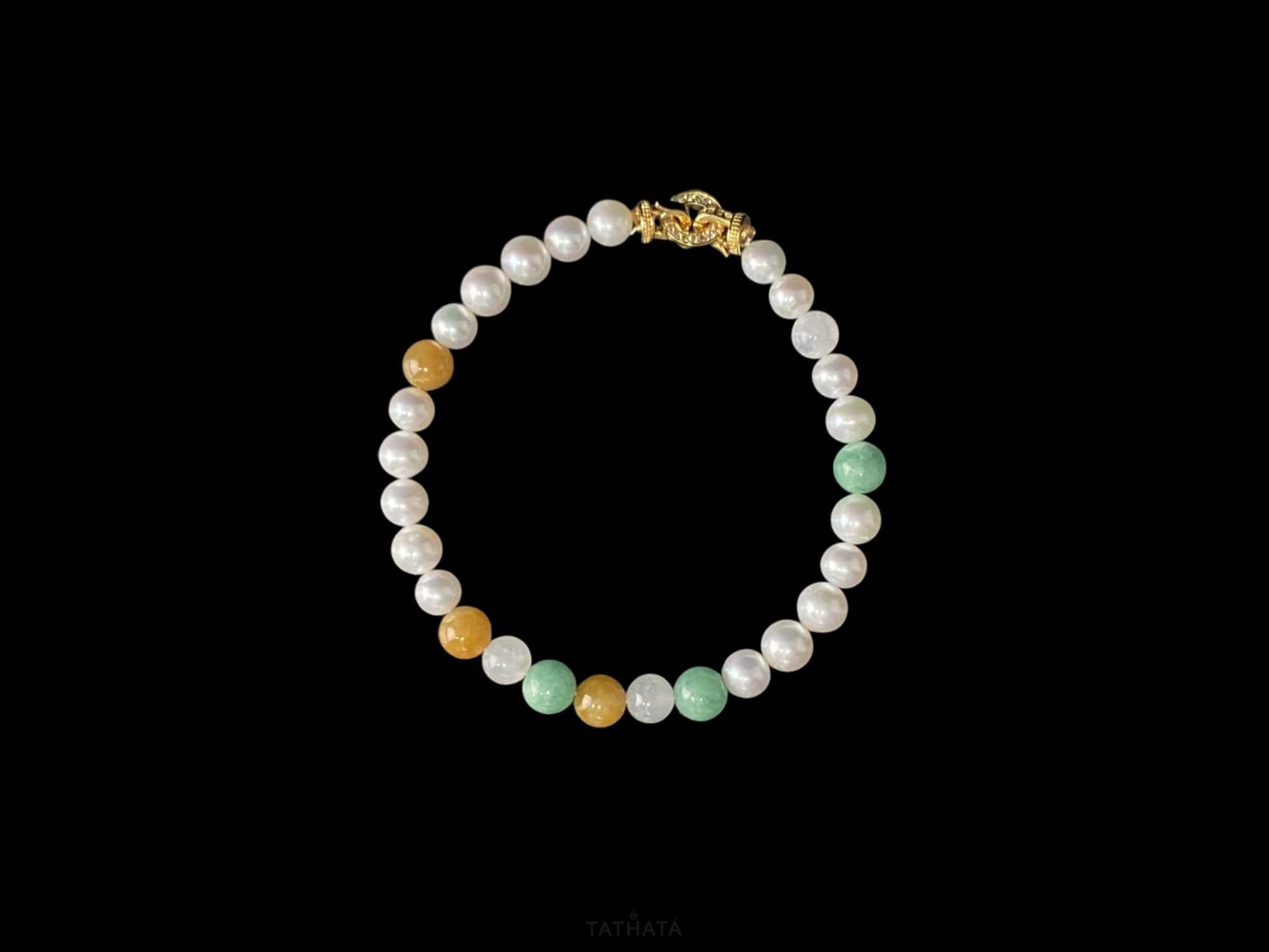 A sunlit mint pearl jadeite beads bracelet.