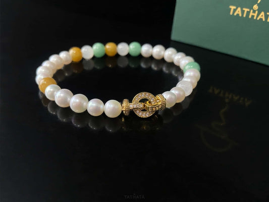 A sunlit mint pearl jadeite beads bracelet.