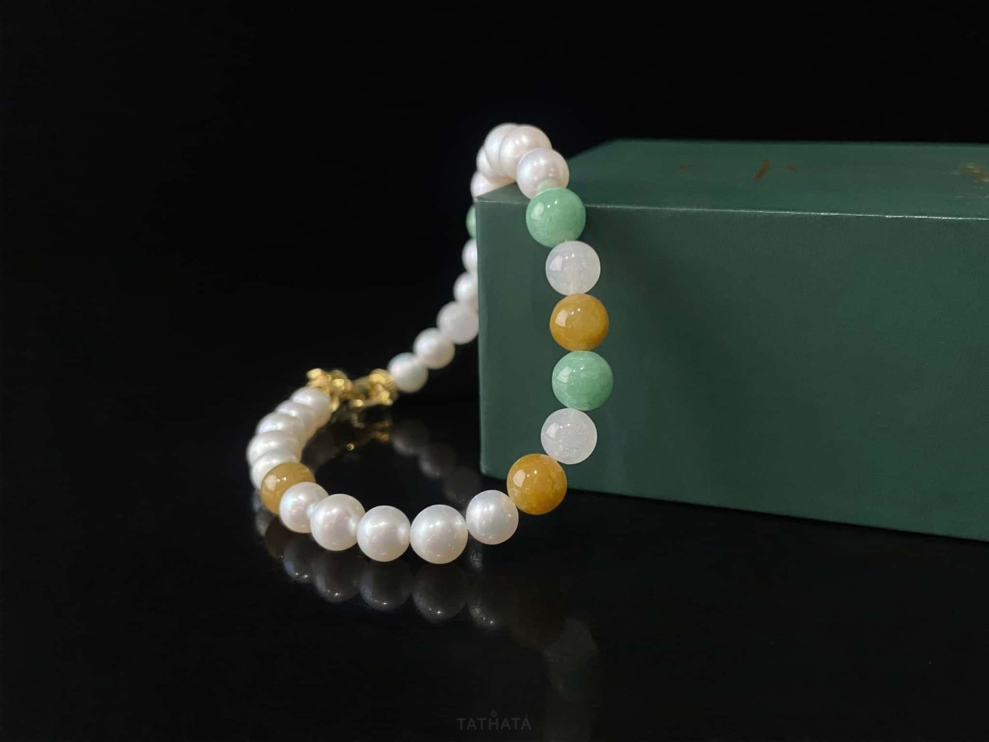 A sunlit mint pearl jadeite beads bracelet.