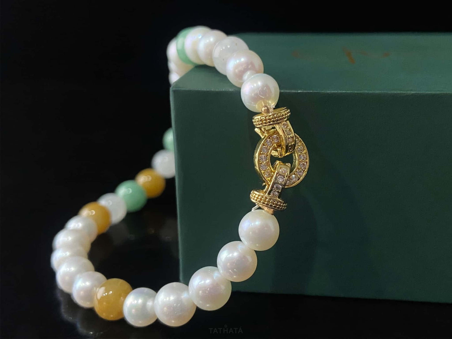A sunlit mint pearl jadeite beads bracelet.