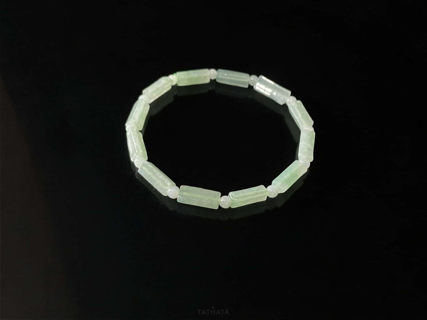A mist green column jadeite beads bracelet.