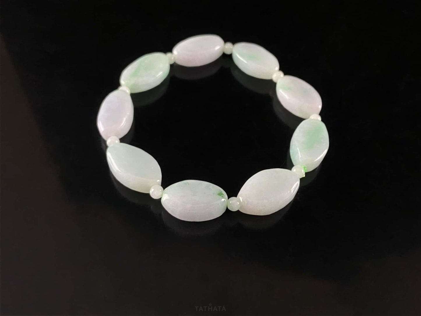 A soft mint cval jadeite beads bracelet.