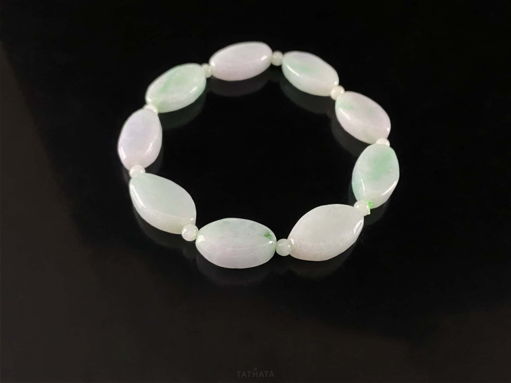 A soft mint cval jadeite beads bracelet.