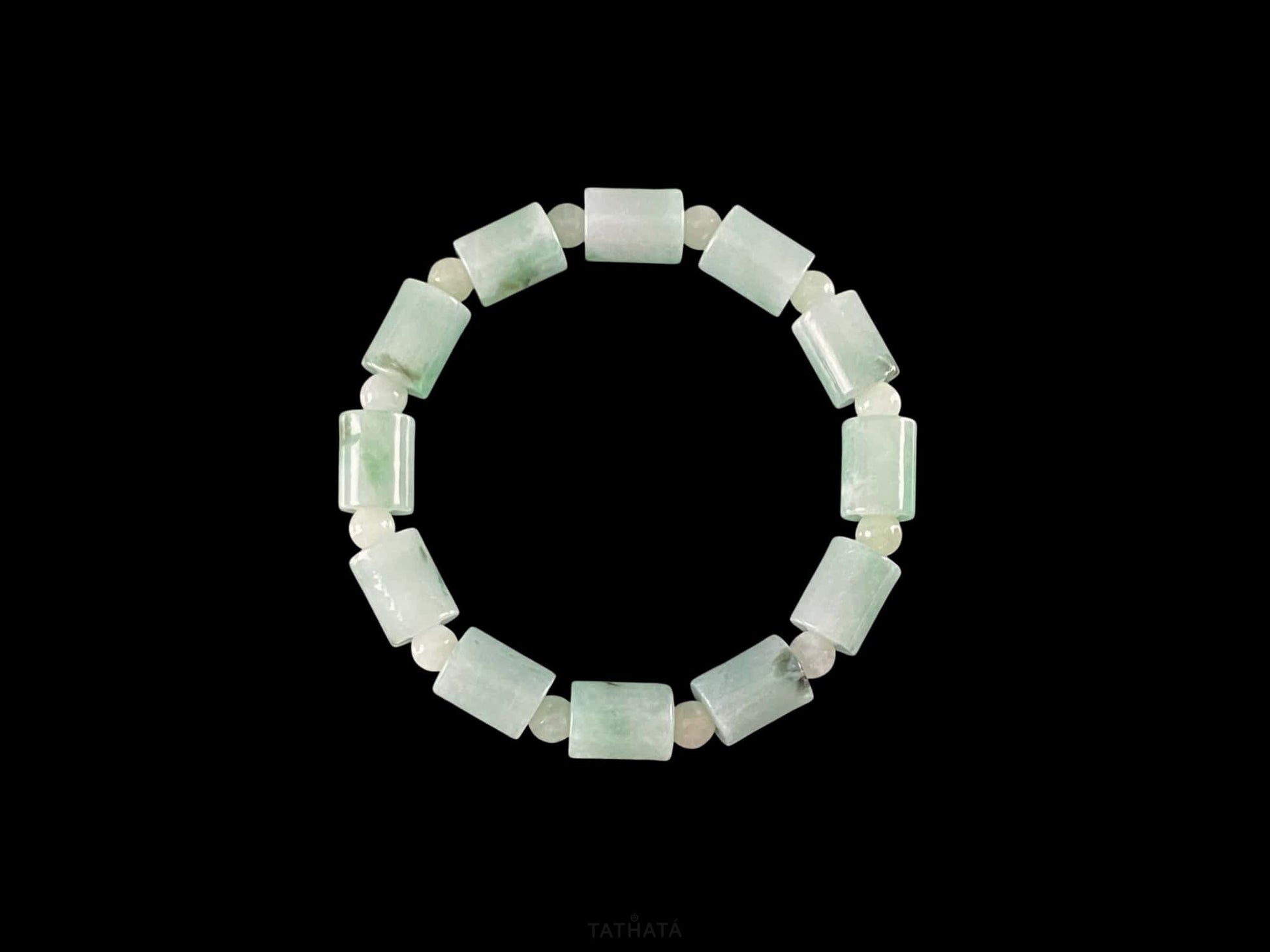 A mint green barrel beads bracelet.