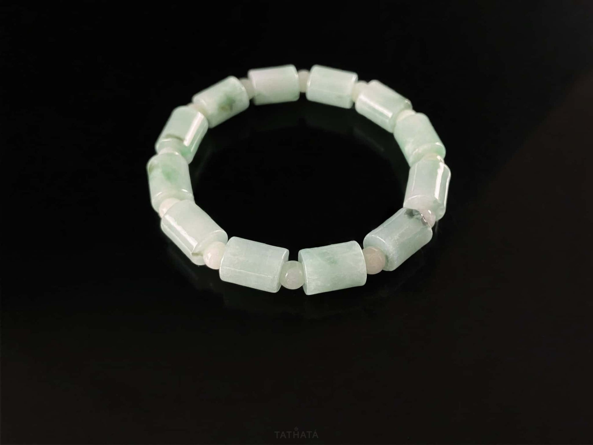 A mint green barrel beads bracelet.