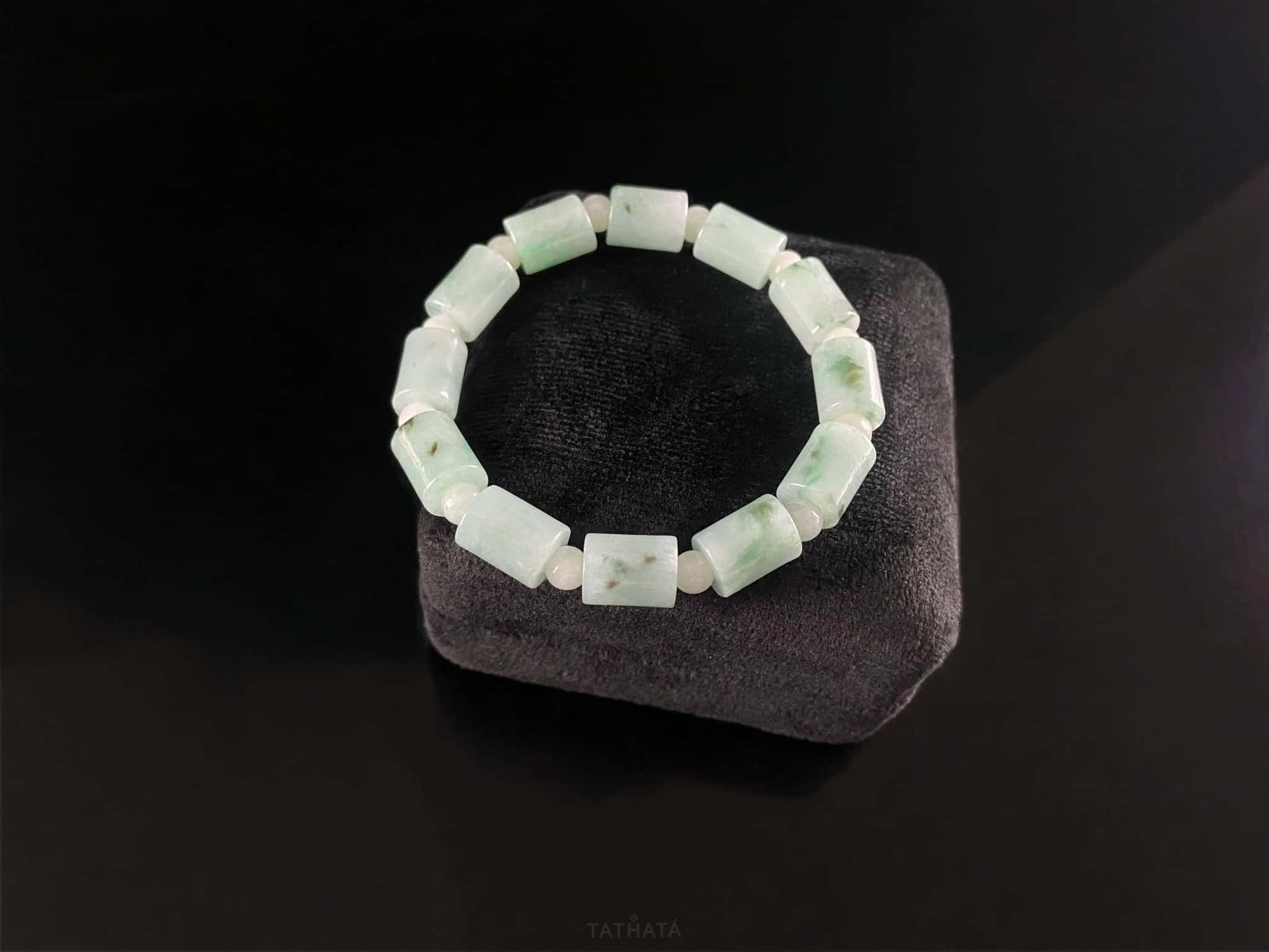 A mint green barrel beads bracelet.