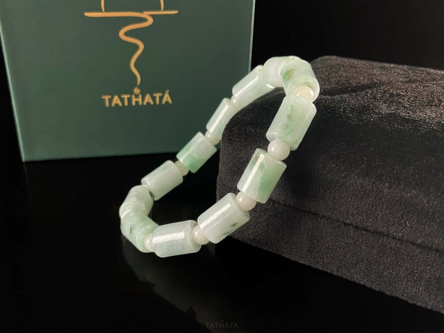 A mint green barrel beads bracelet.