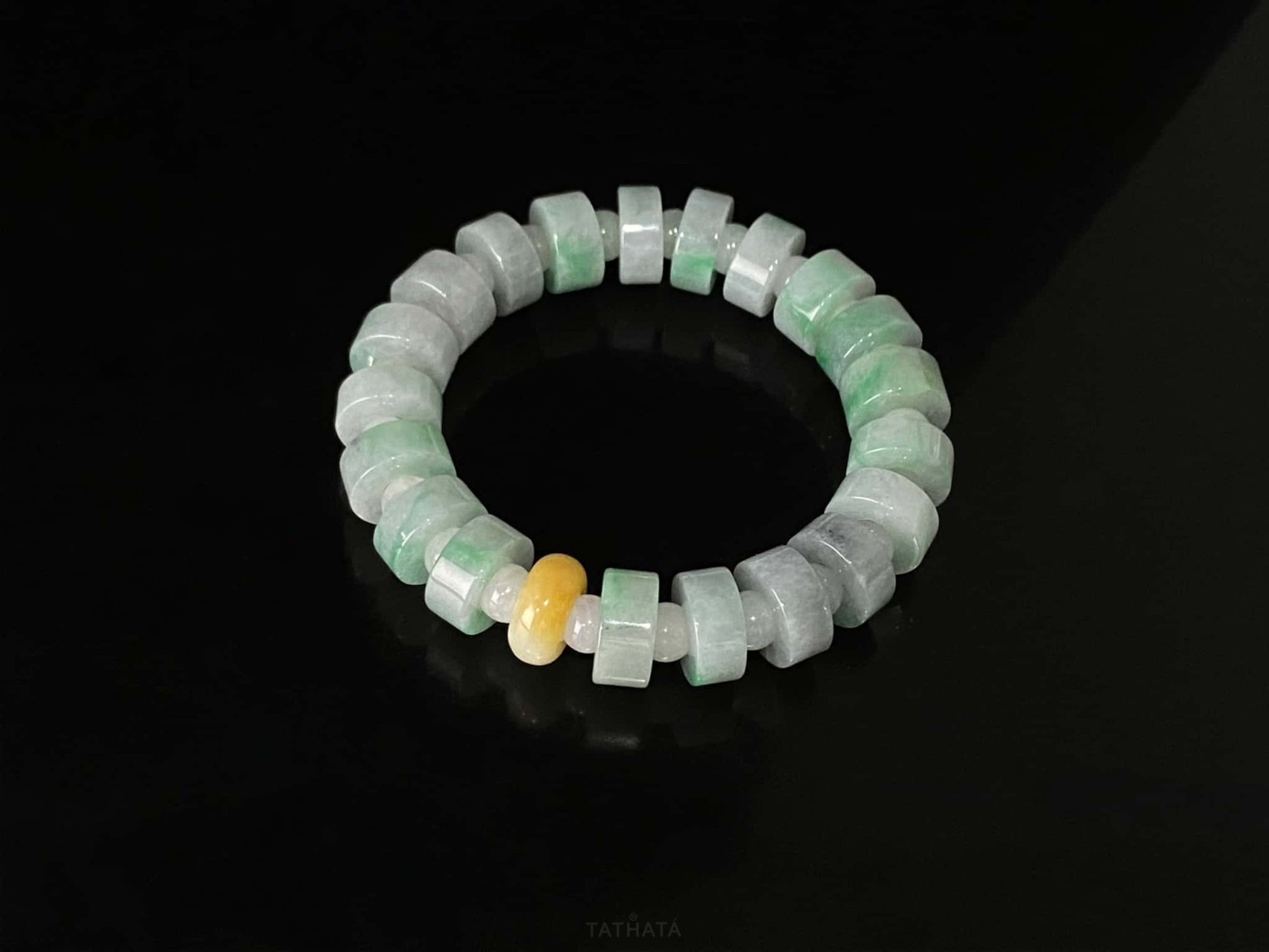 A cylinder mint yellow slice jadeite beads bracelet.