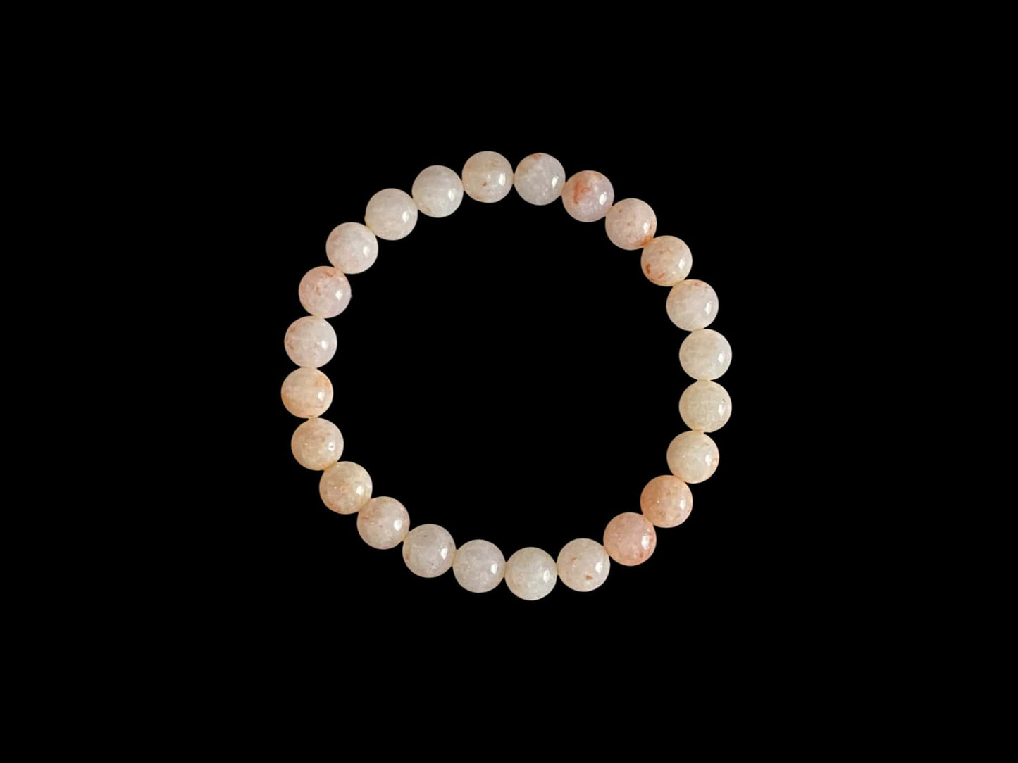 A warm peach tone jadeite beads bracelet.