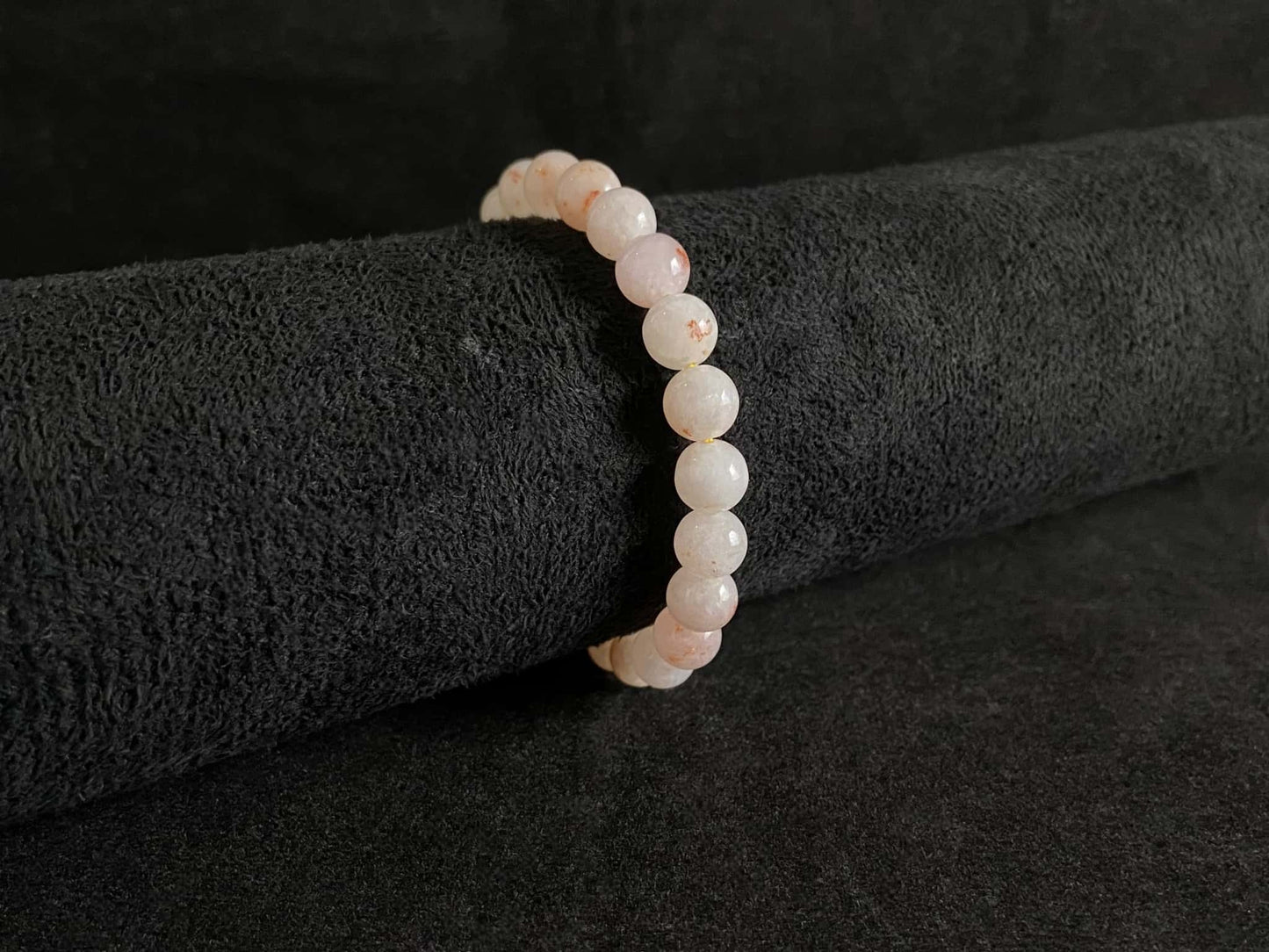 A warm peach tone jadeite beads bracelet.