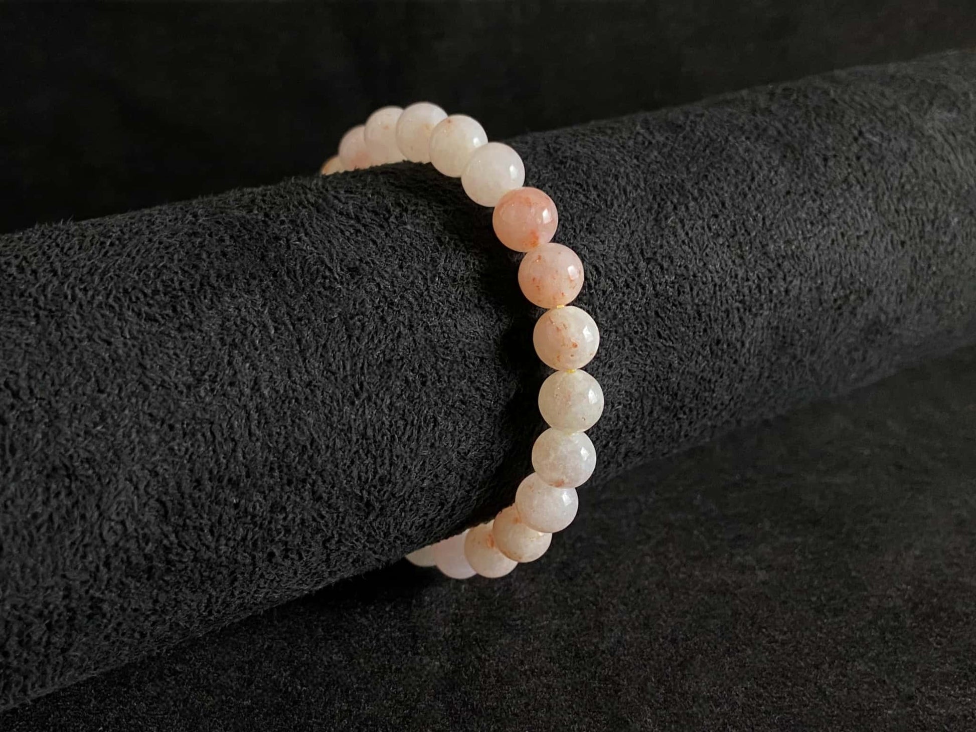 A warm peach tone jadeite beads bracelet.