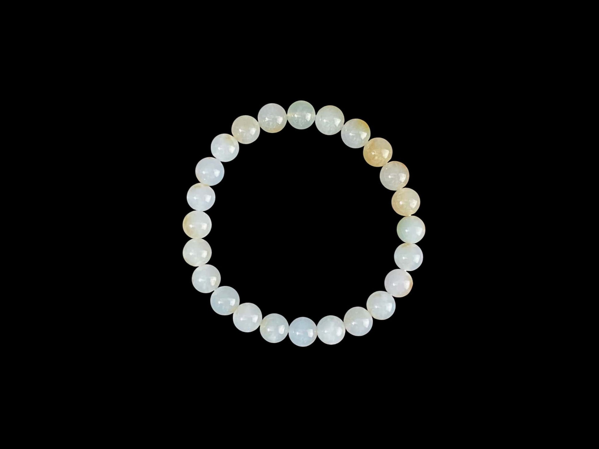 A milky golden hue jadeite beads bracelet.