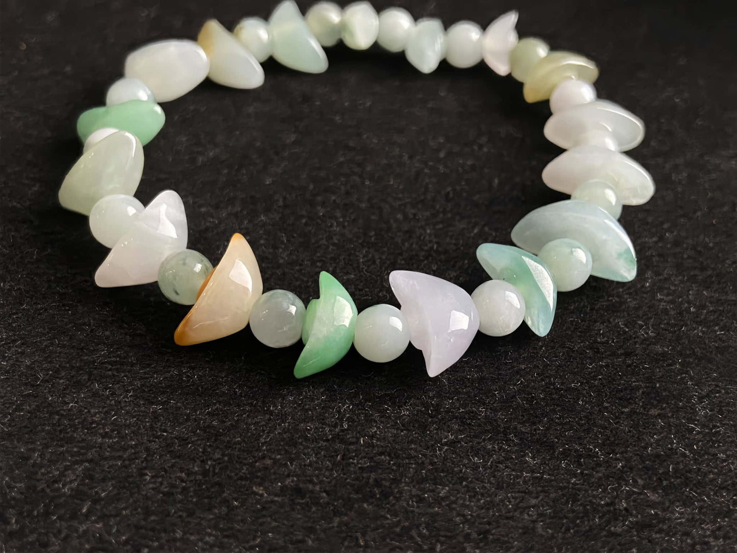 A multicolor wealth Yuanbao jadeite beads bracelet.