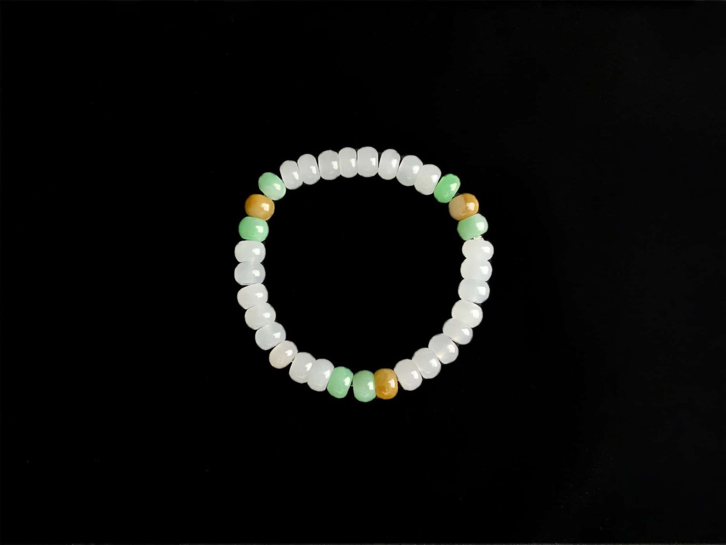 A golden green white blessing jadeite beads bracelet.