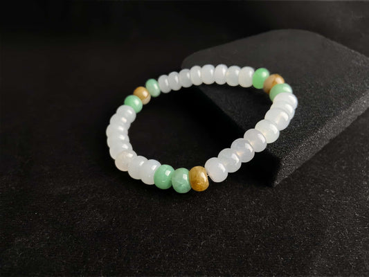 A golden green white blessing jadeite beads bracelet.