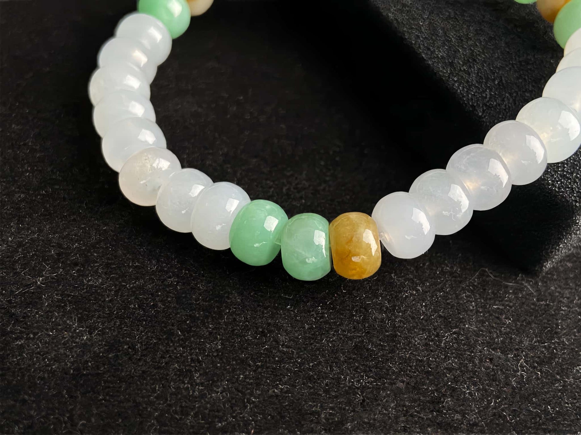 A golden green white blessing jadeite beads bracelet.