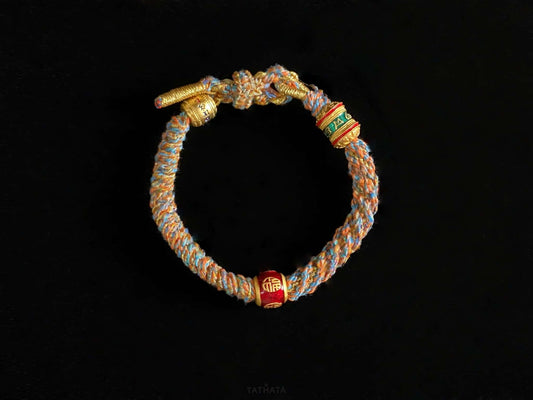 A mantra fortune woven tibetan bracelet.