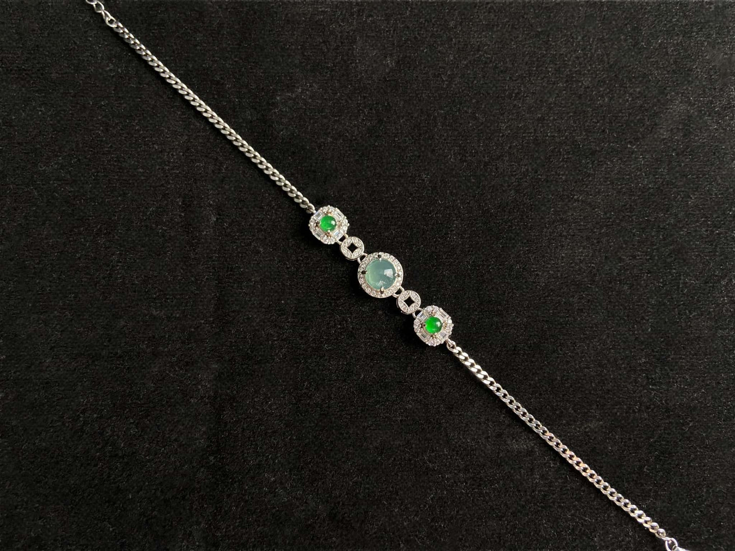 A green aqua fortune link jadeite  bracelet.