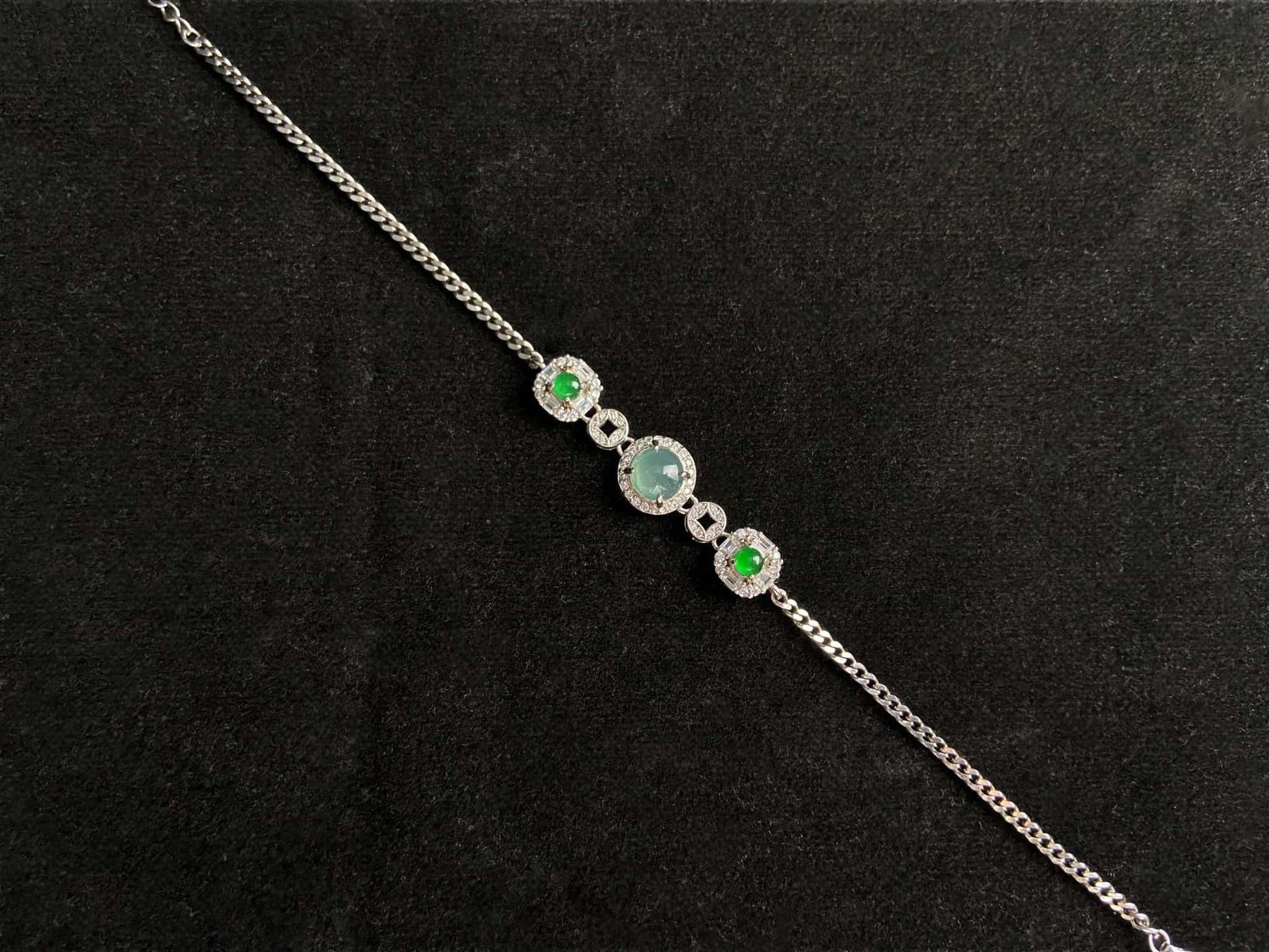 A green aqua fortune link jadeite  bracelet.