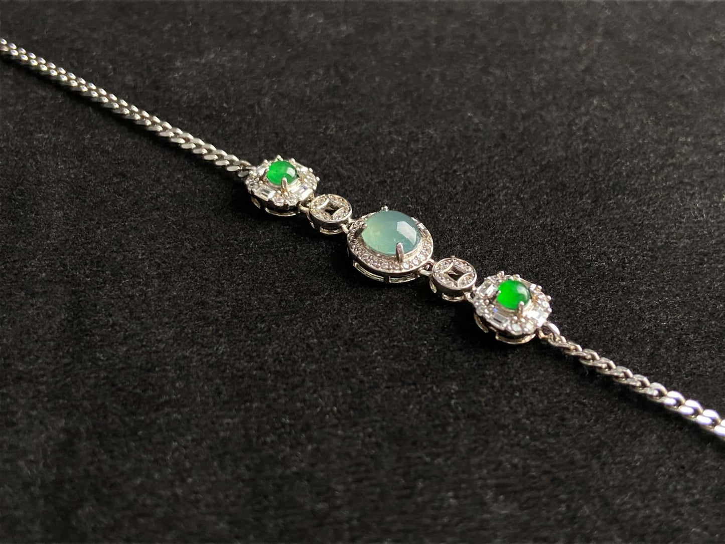 A green aqua fortune link jadeite  bracelet.