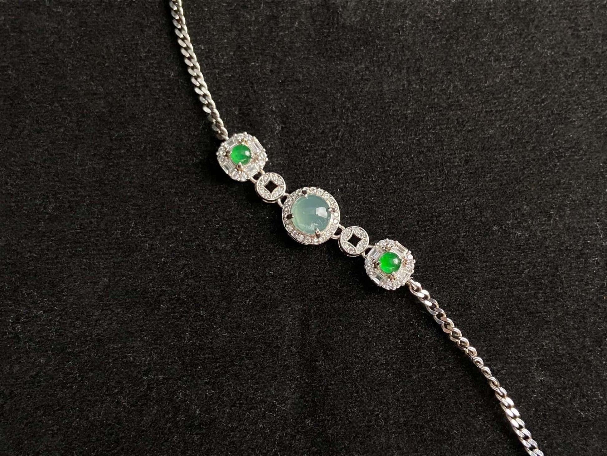 A green aqua fortune link jadeite  bracelet.