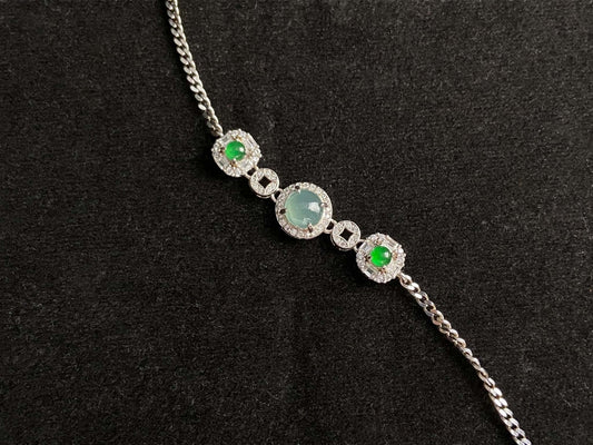 A green aqua fortune link jadeite  bracelet.