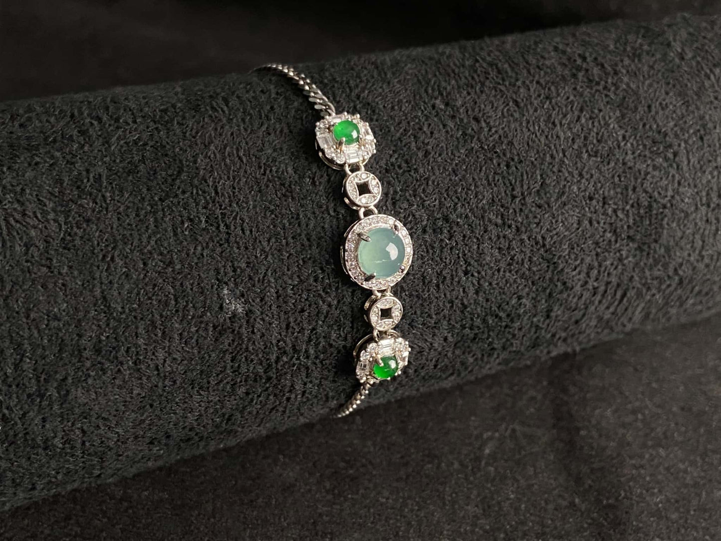 A green aqua fortune link jadeite  bracelet.