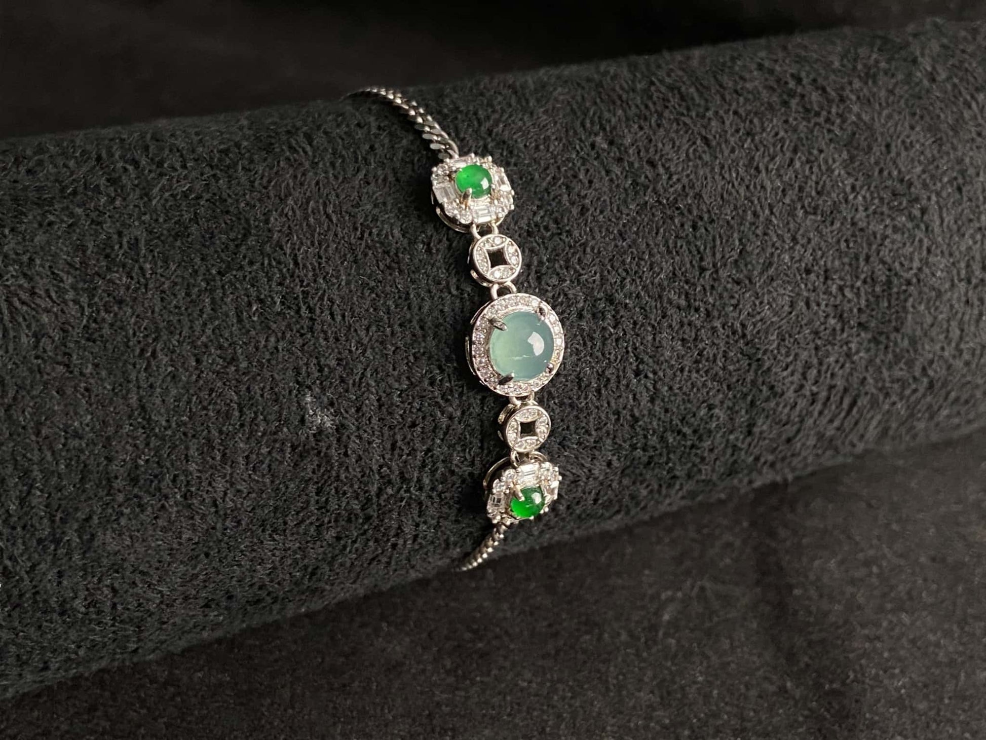 A green aqua fortune link jadeite  bracelet.