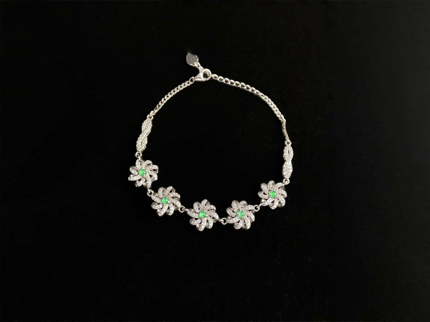 A lime green flowerburs jadeite bracelet.