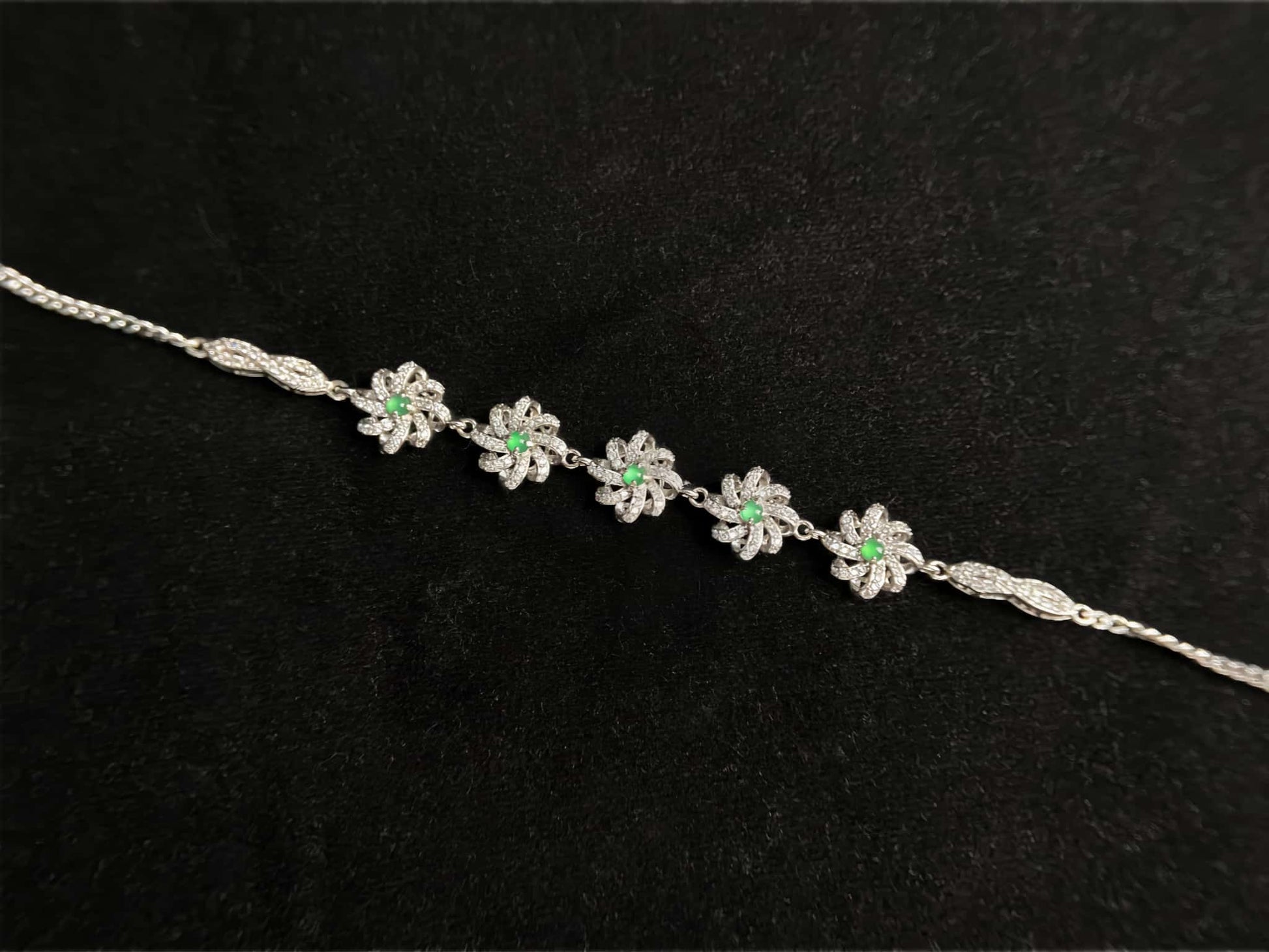 A lime green flowerburs jadeite bracelet.