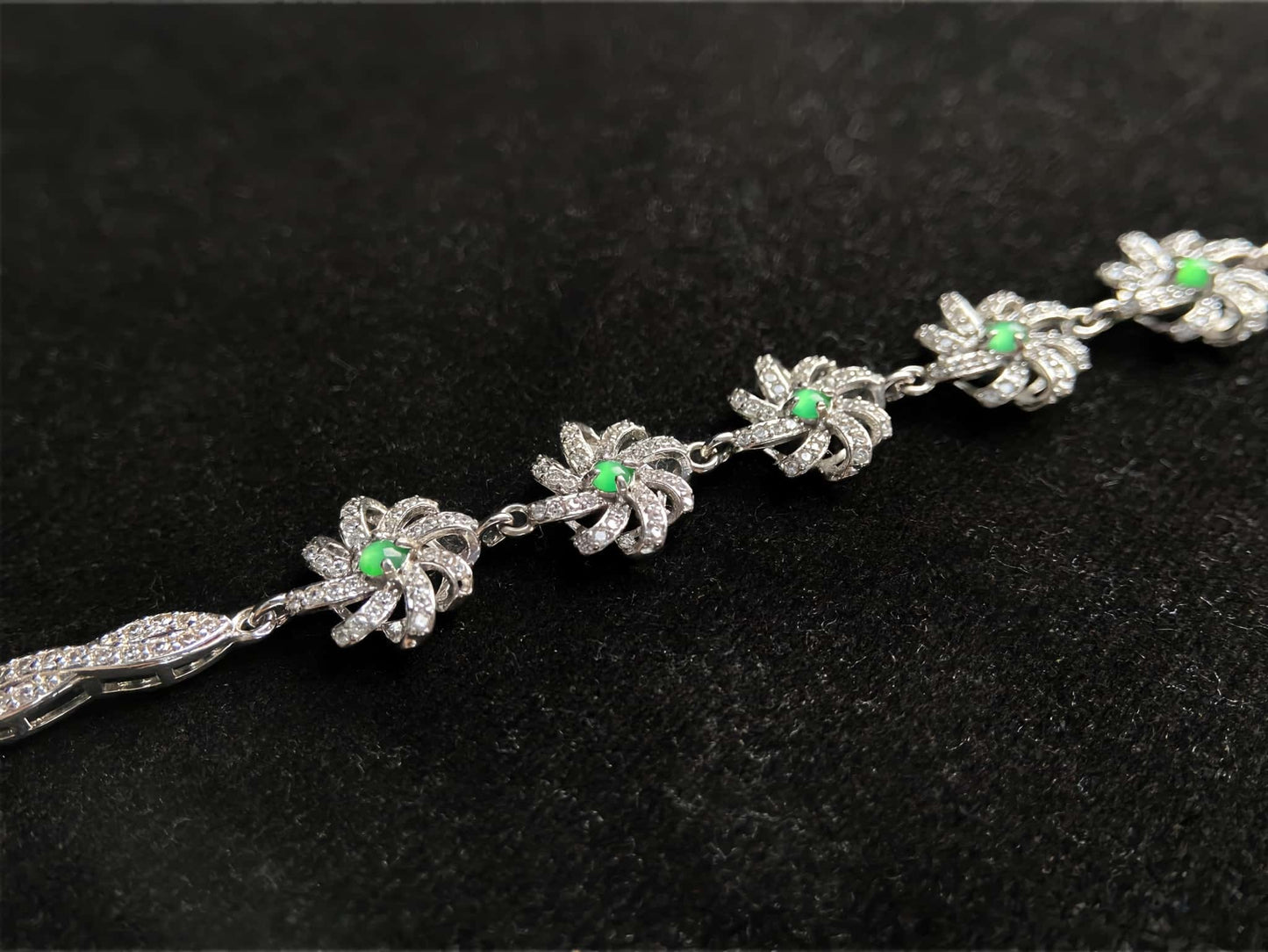 A lime green flowerburs jadeite bracelet.