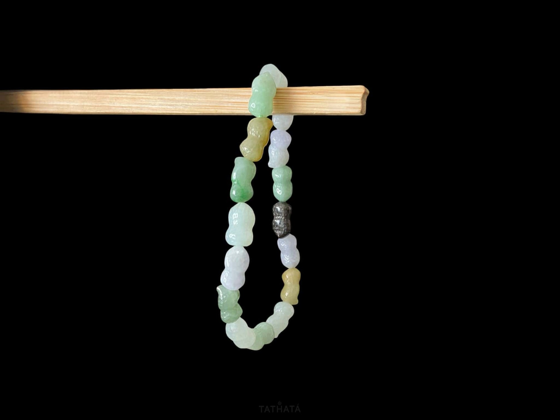 A multi color peanut jadeite beads bracelet.