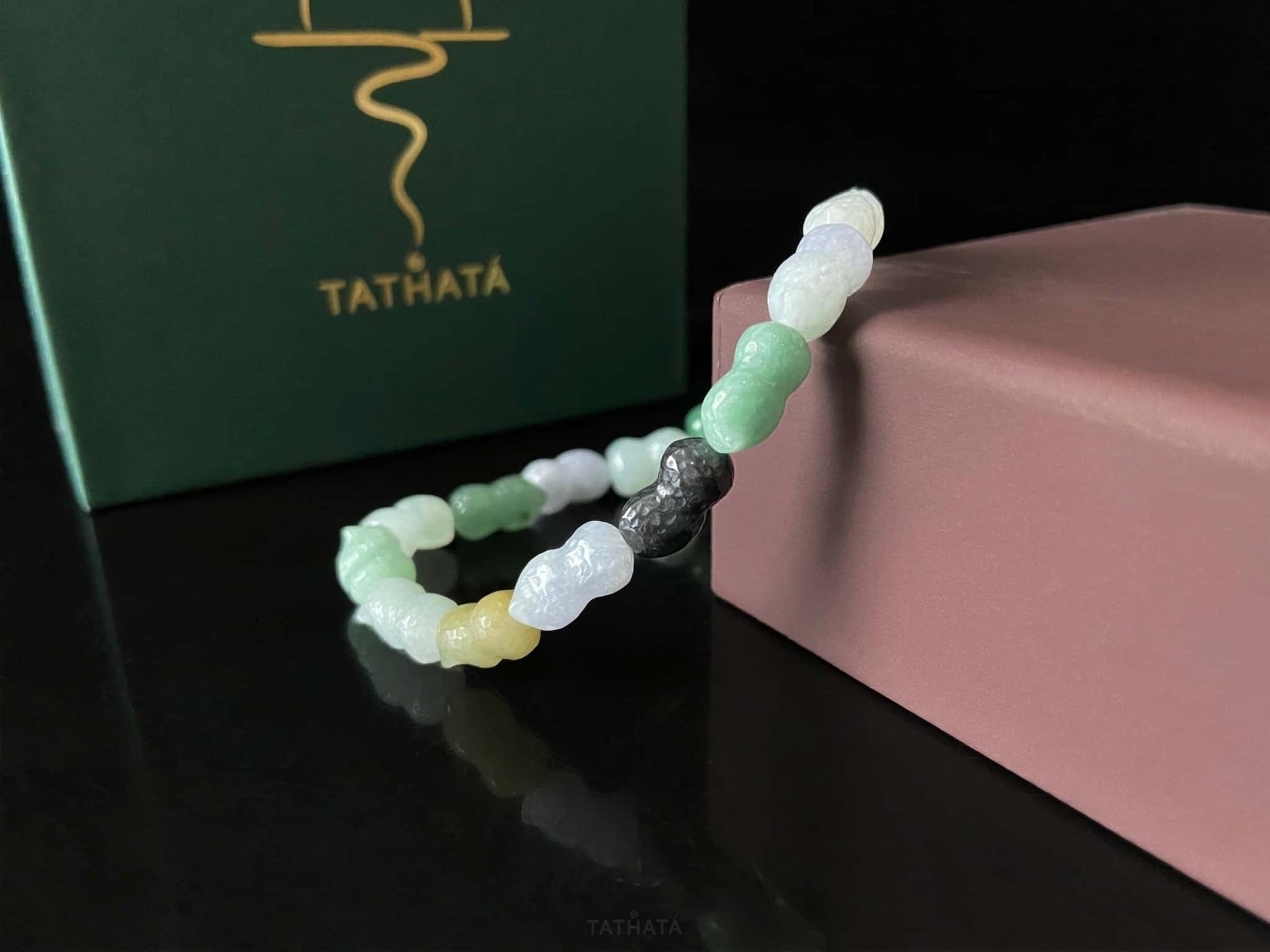 A multi color peanut jadeite beads bracelet.