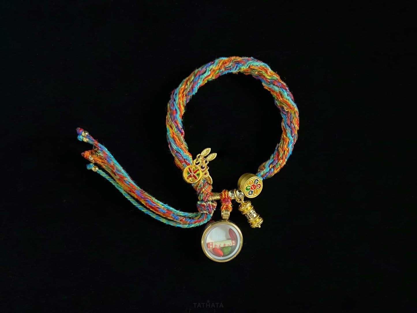 A chenrezig gau ainbow woven bracelet.