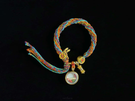 A chenrezig gau ainbow woven bracelet.