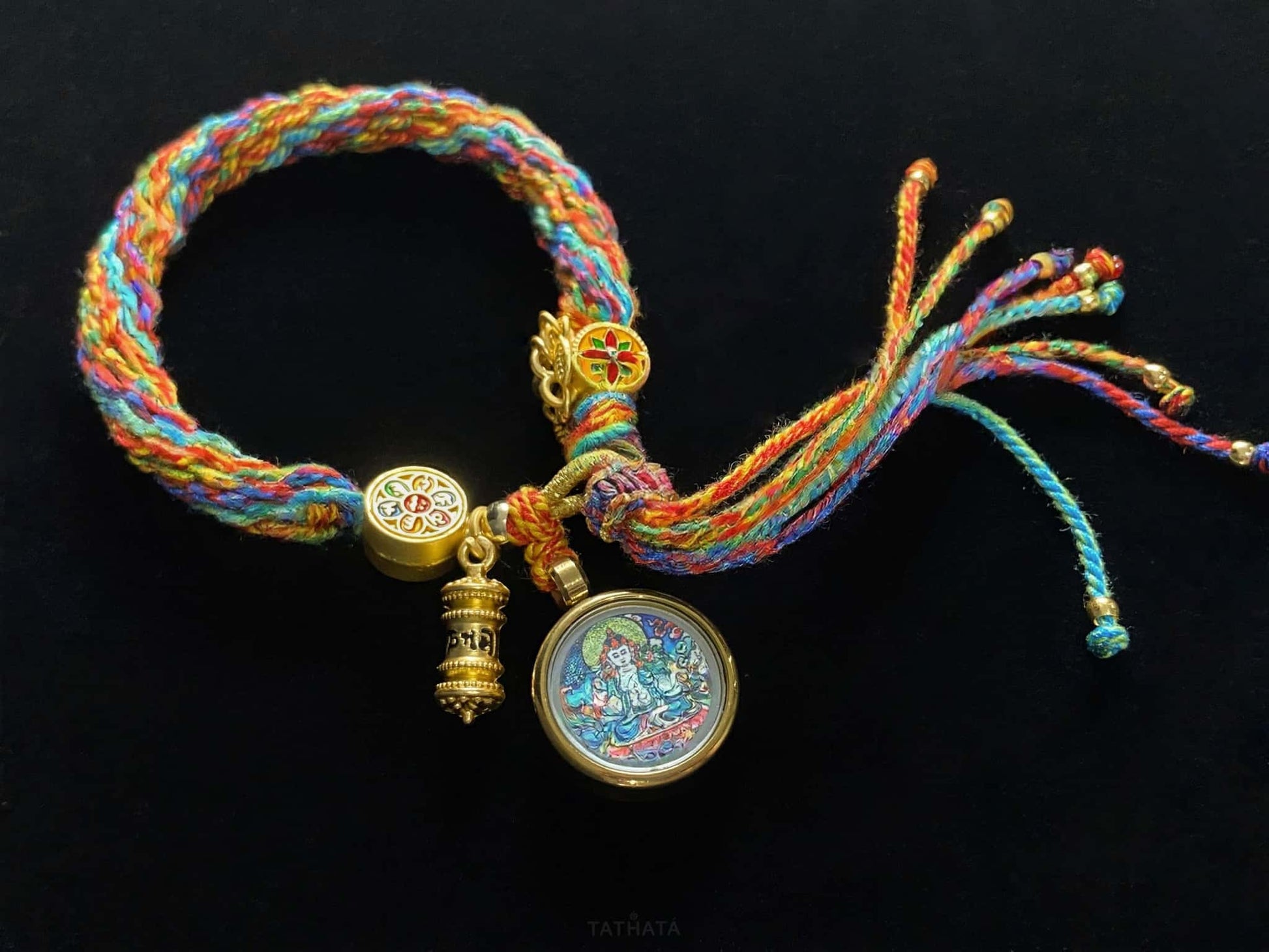 A chenrezig gau ainbow woven bracelet.