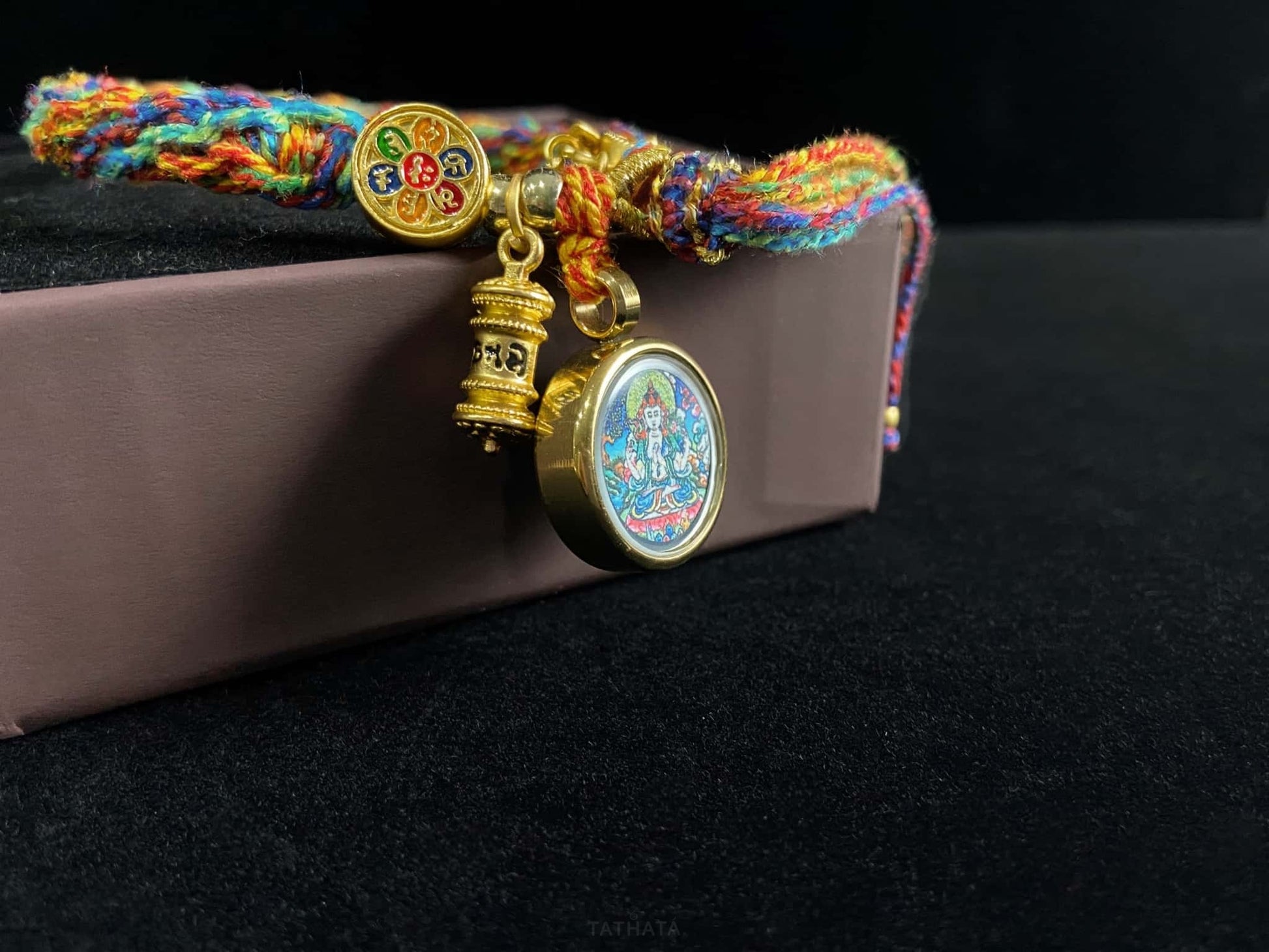 A chenrezig gau ainbow woven bracelet.