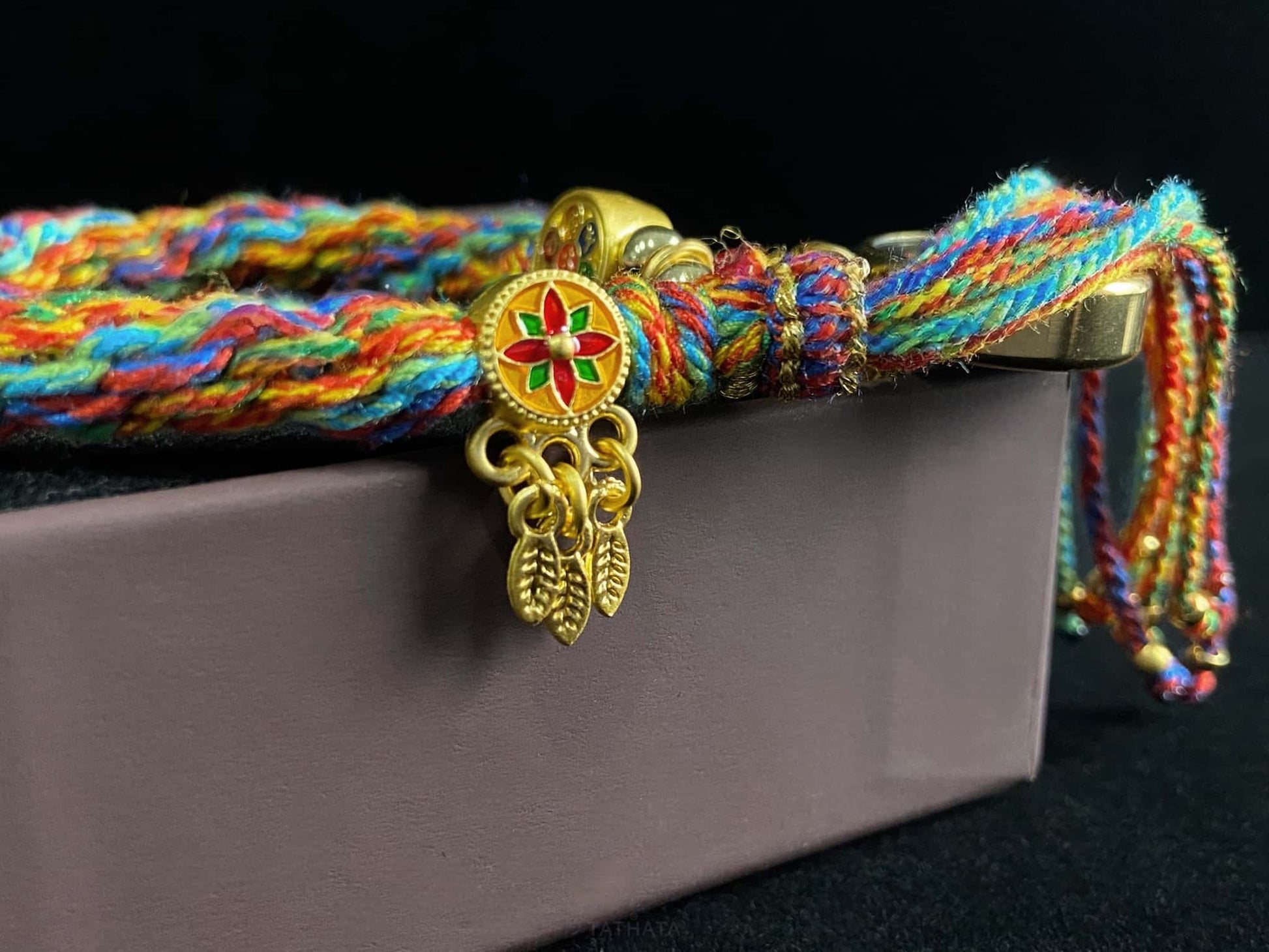 A chenrezig gau ainbow woven bracelet.