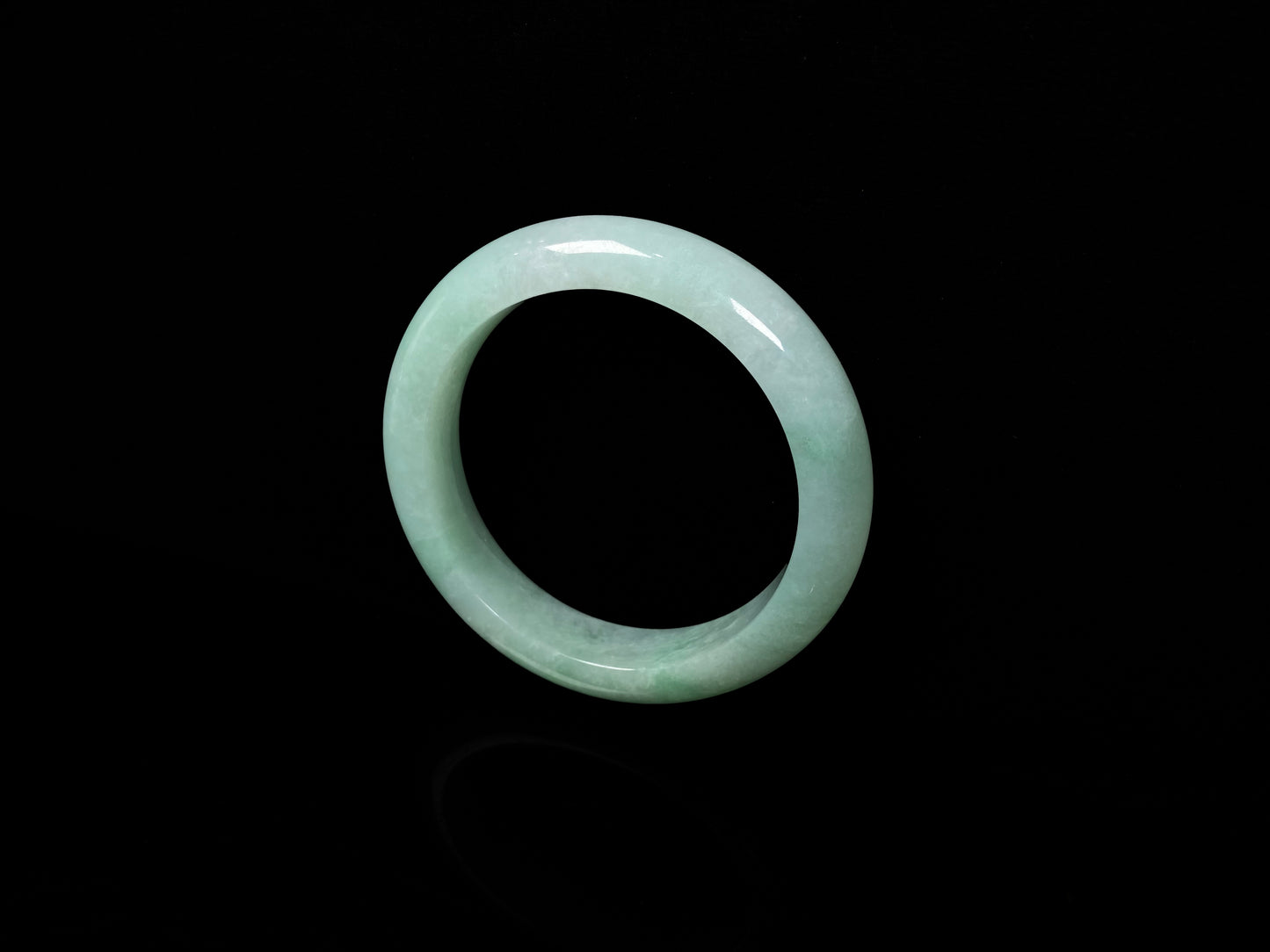 A apple green crisp bloom jadeite bangle.