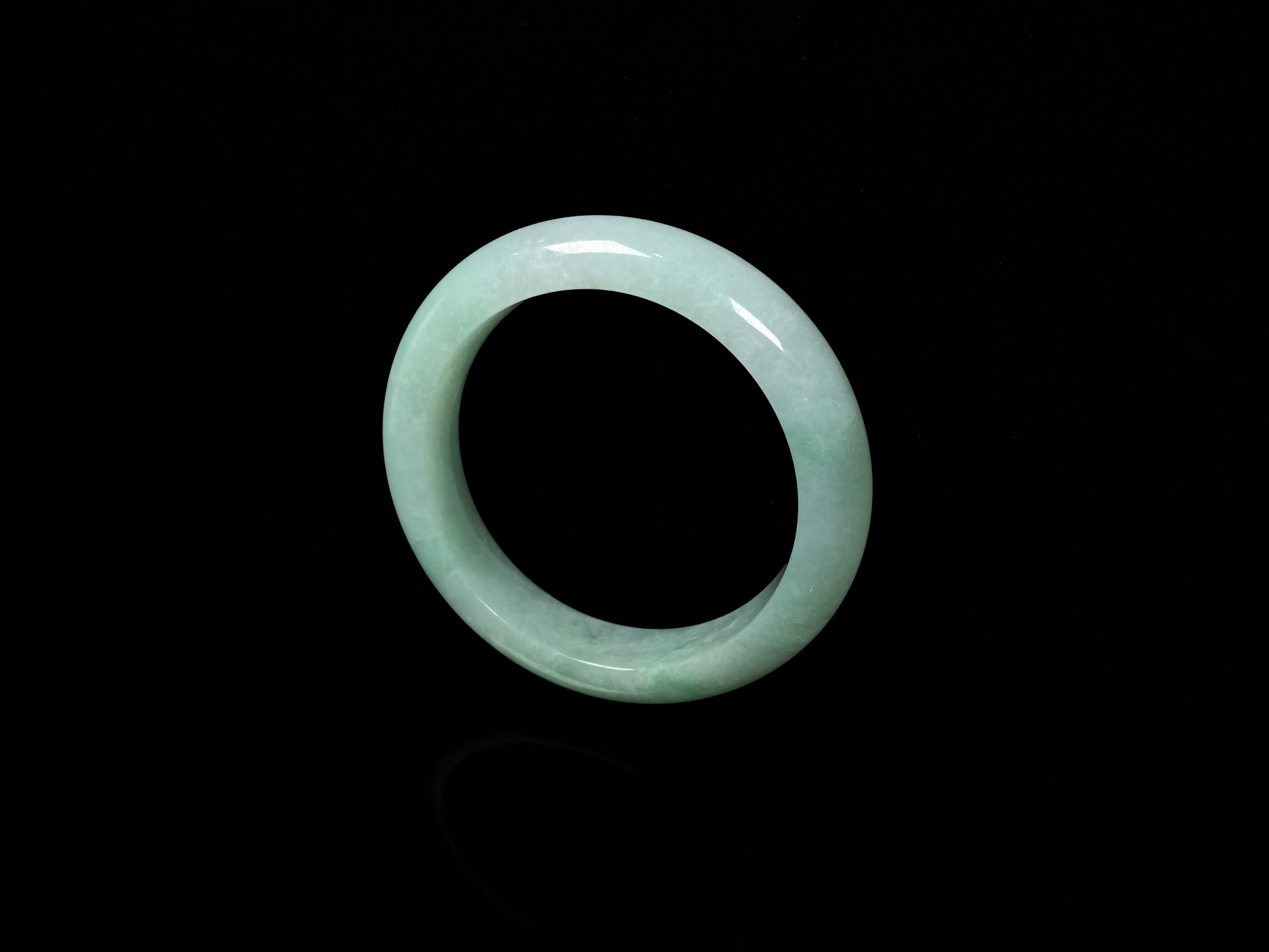 A apple green crisp bloom jadeite bangle.