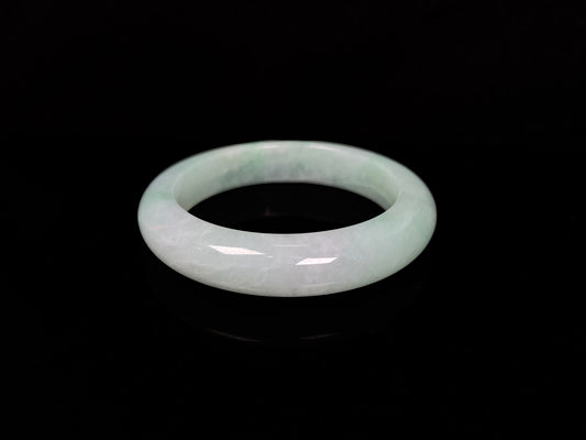 A apple green crisp bloom jadeite bangle.