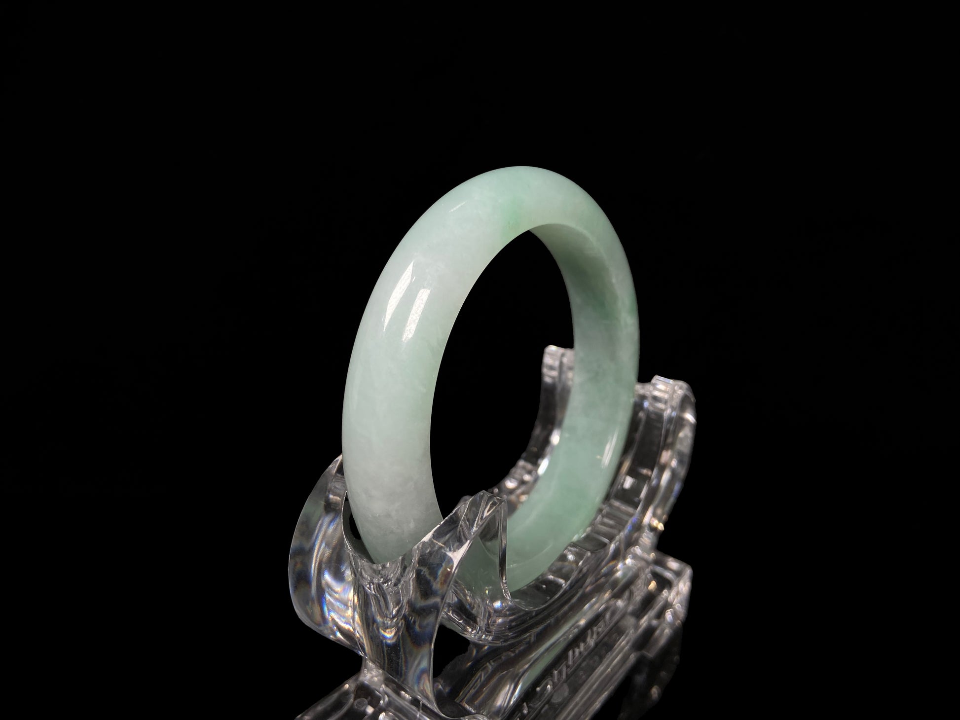 A apple green crisp bloom jadeite bangle.