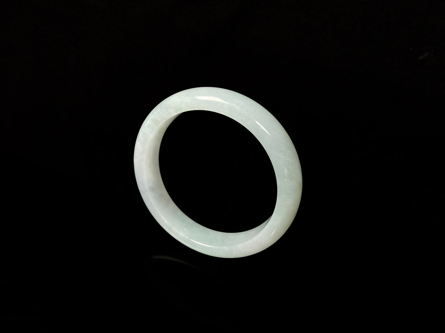 A pale white green mist jadeite bangle.