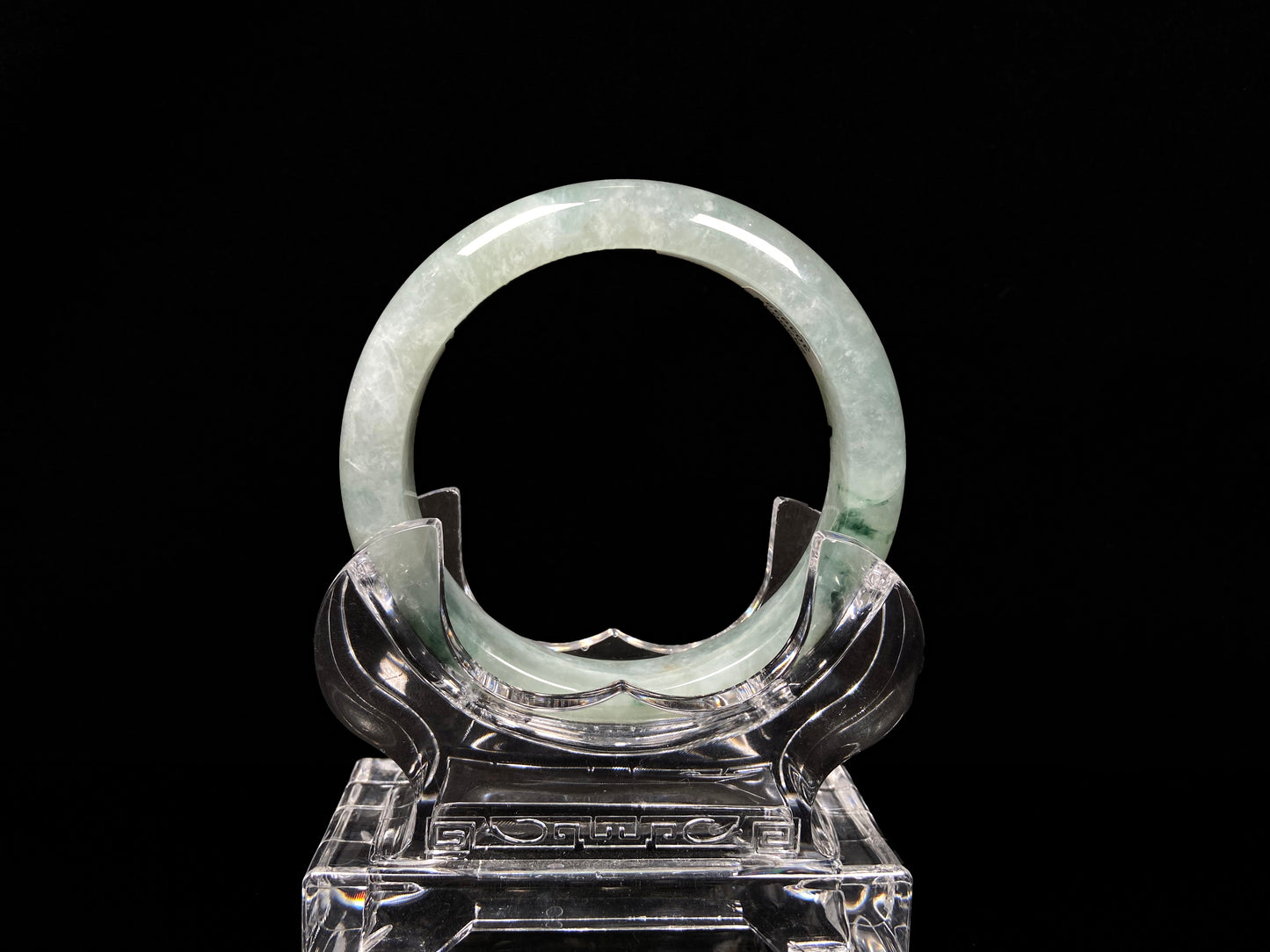 A misty cloud floral green jadeite bangle.