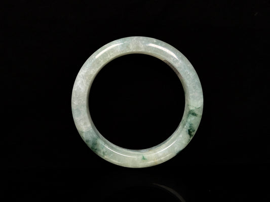 A misty cloud floral green jadeite bangle.