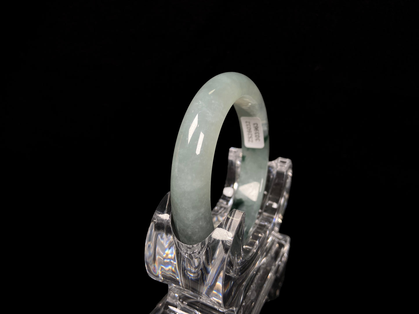A moss green icy bloom jadeite bangle.